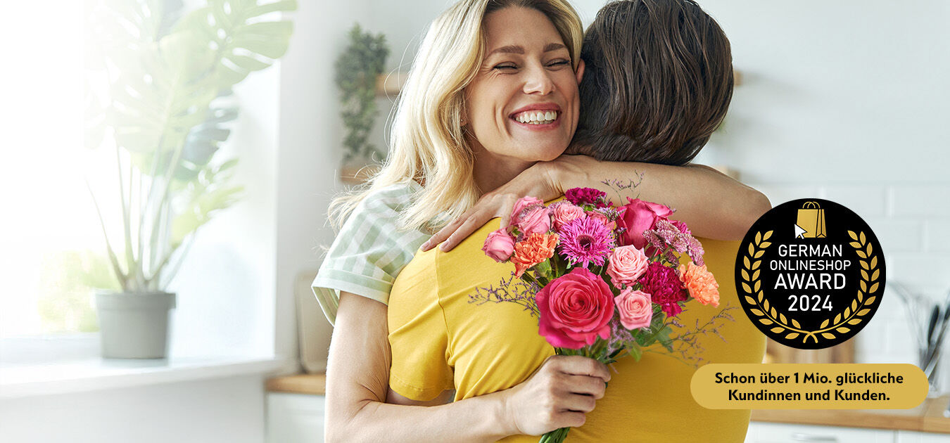 BD_Buehne_uerbergabe_Desktop_1350x630px Blumen-Arrangement, Blumenstrauß, Erwachsener, Person, Frau